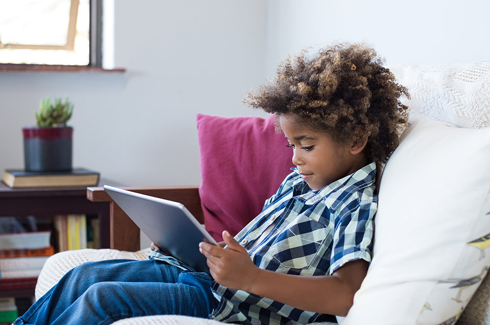 Boy sitting on couch