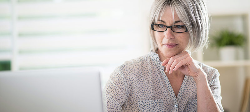 Woman at a computer making an Appointment