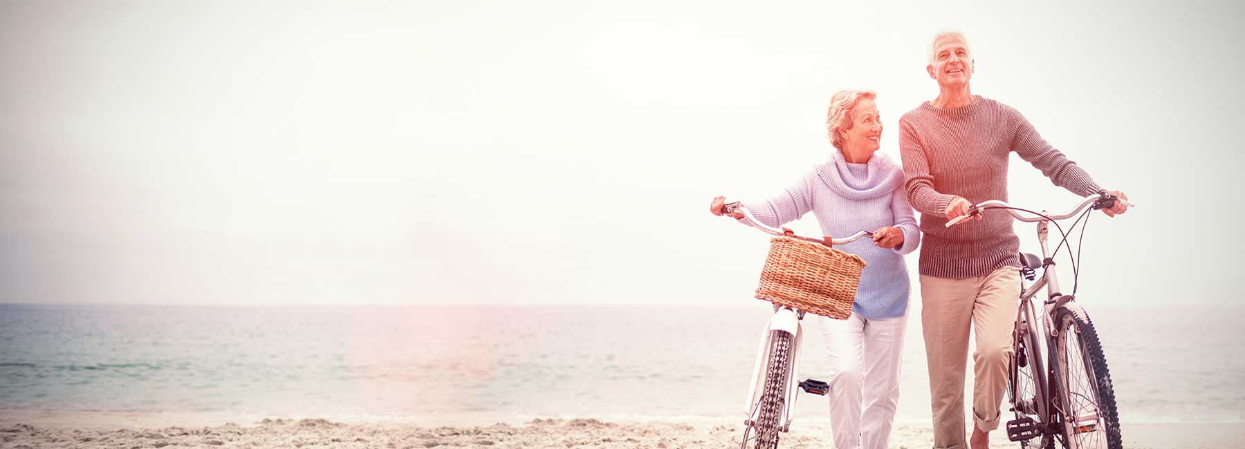 Happy Couple Walking On The Beach