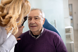 man having eyes examined